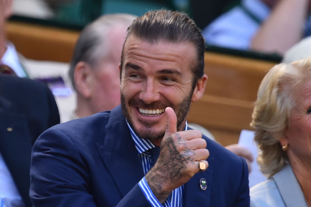 Former England footballer David Beckham gestures as he sits in the Royal Box on Centre Court on the fifth day of the 2017 Wimbledon Championships at The All England Lawn Tennis Club in Wimbledon, southwest London, on July 7, 2017.