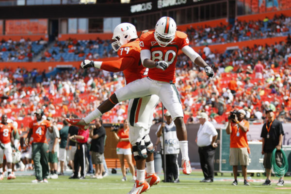 Miami players Rashawn Scott, right, and Malcolm Bunch, left, celebrate an orange team touchdown during the Hurricanes' spring football game at Sun Life Stadium Stadium in Miami, Florida, Saturday, April 13, 2013. (Gregory Castillo/Miami Herald/MCT via Getty Images)