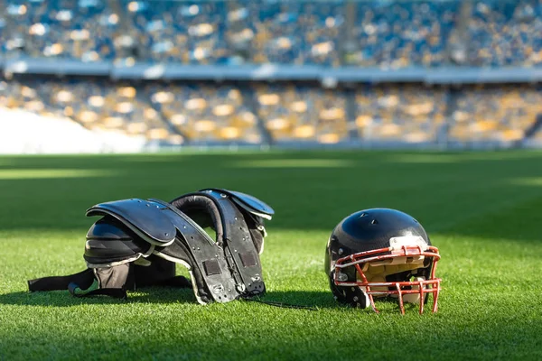 American Football Helmet Chest Protection Lying Green Grass Stadium Лицензионные Стоковые Фото