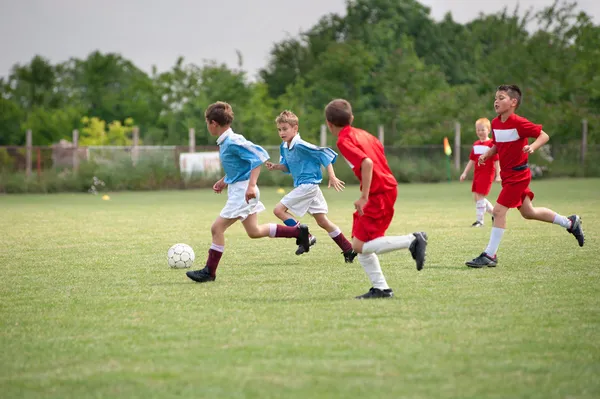 Футбол детей Лицензионные Стоковые Фото